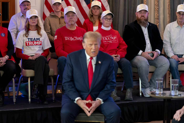 Trump's supporters stand for hours in the cold to see him in Iowa a day before the GOP caucuses