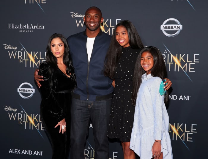 Kobe Bryant dons teal suit out with wife Vanessa in LA