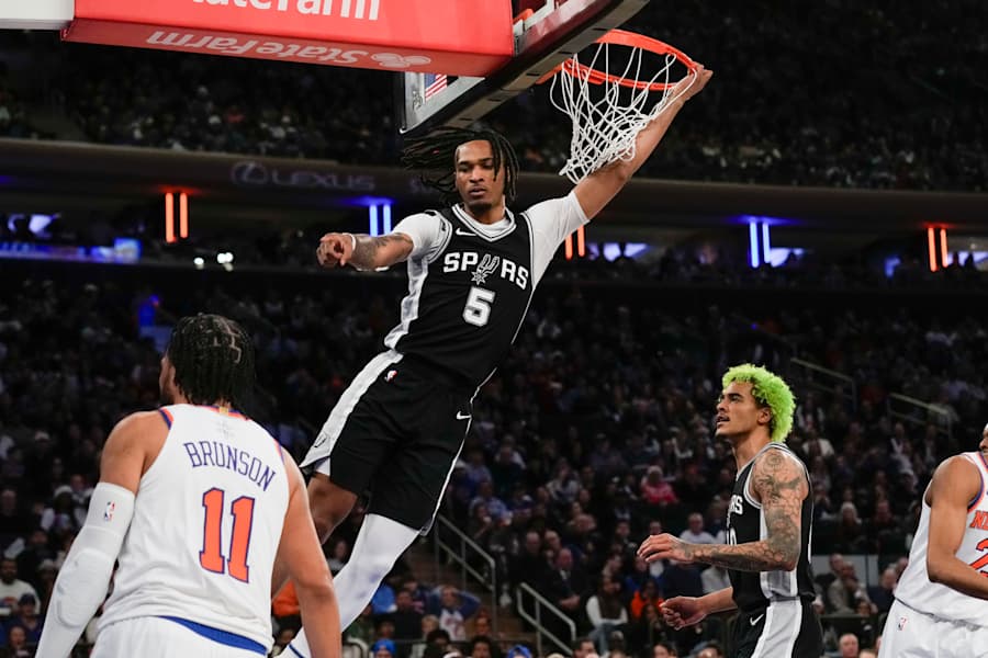 San Antonio Spurs' Stephon Castle, top, reacts after dunking the ball during the first half of an NBA basketball game against the New York Knicks, Wednesday, Dec. 25, 2024, in New York. (AP Photo/Seth Wenig) (Seth Wenig, Copyright 2024 The Associated Press. All rights reserved.)