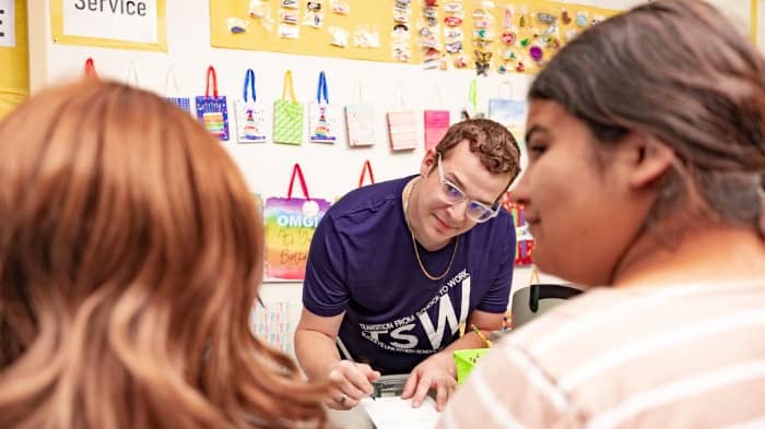 GCU student working with children in classroom setting