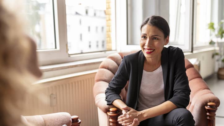 Female counselor meeting in-person with client for session