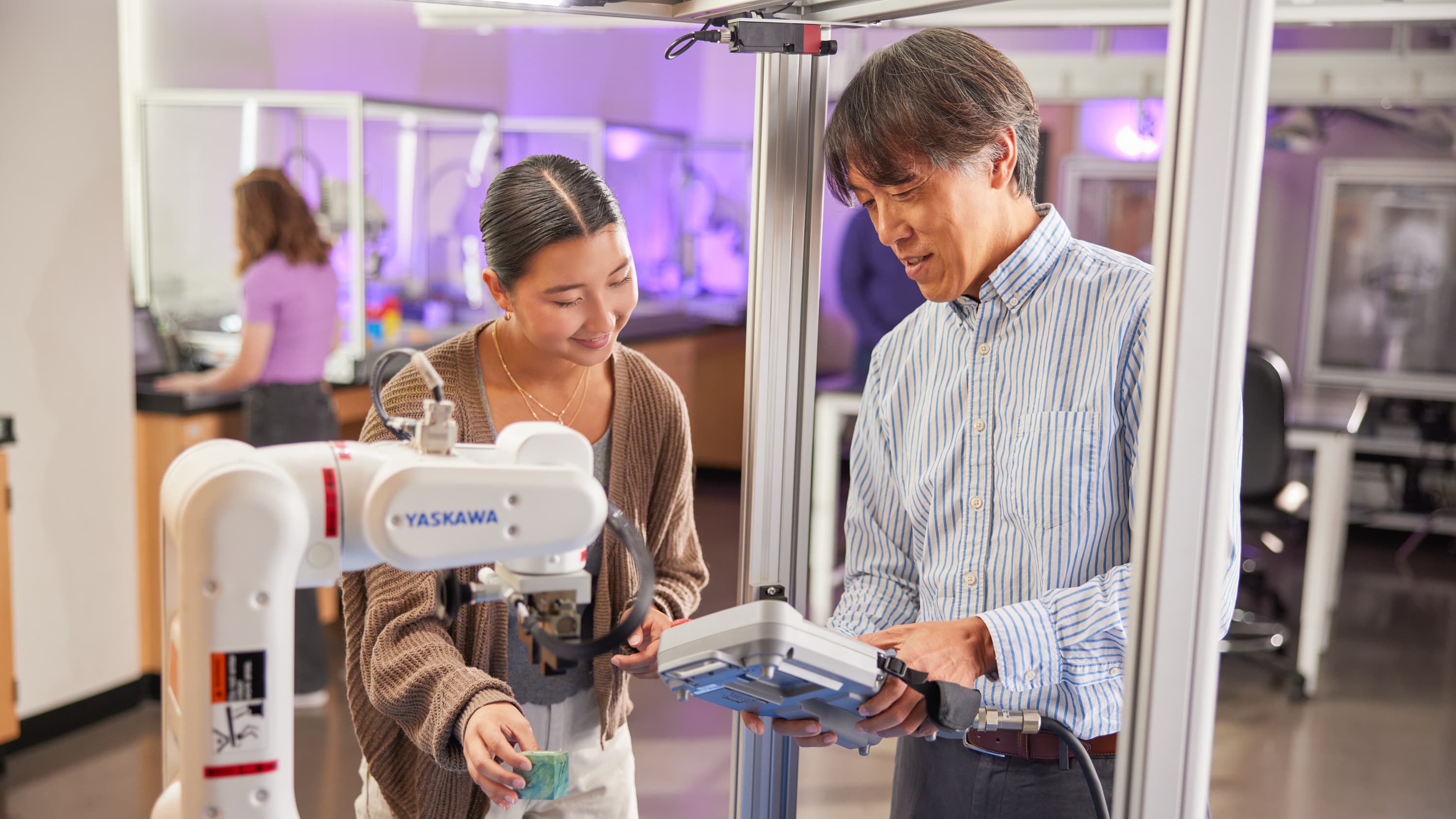 Professor and student working together on project