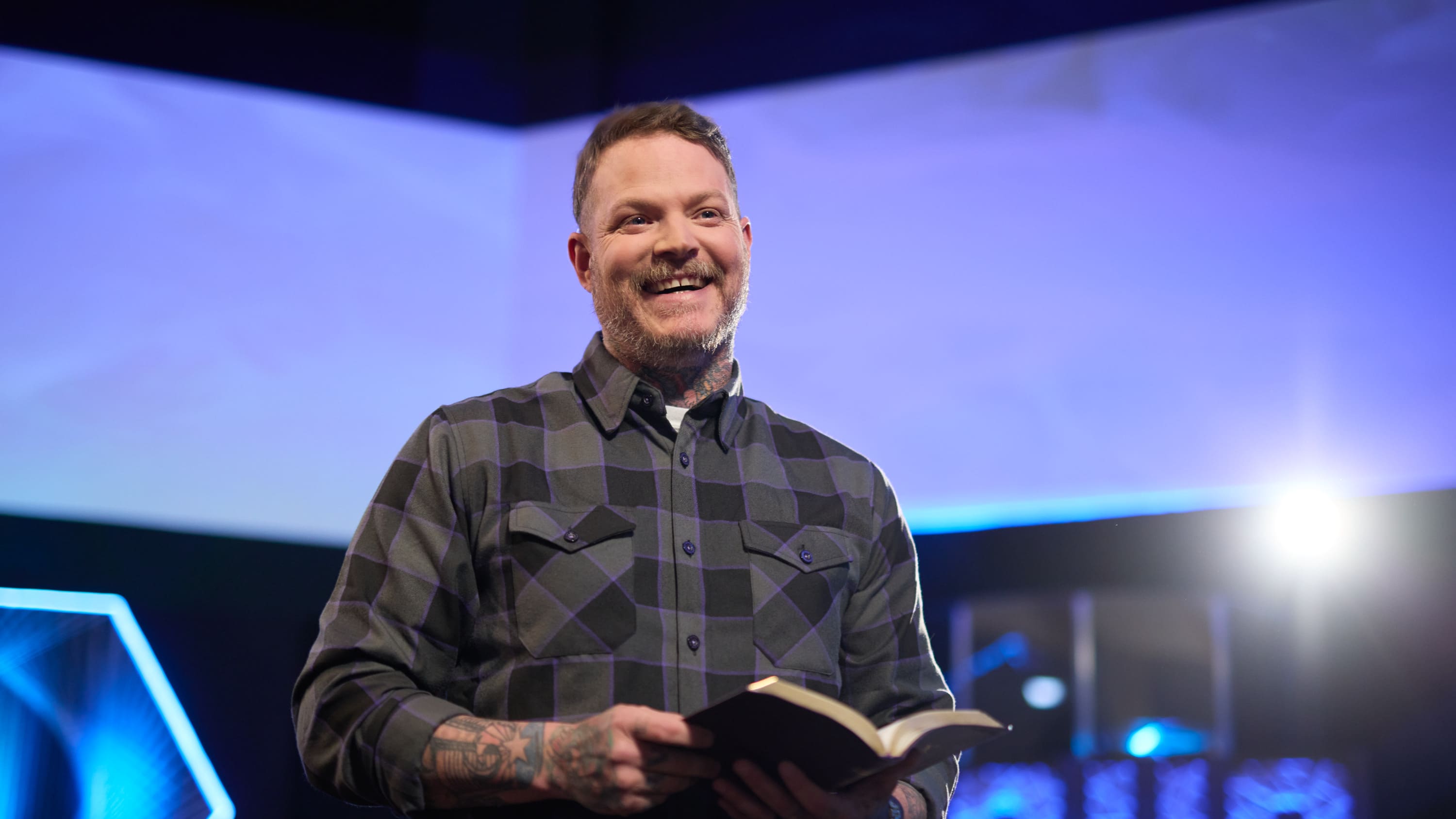 Male doctoral ministry program student smiling in church