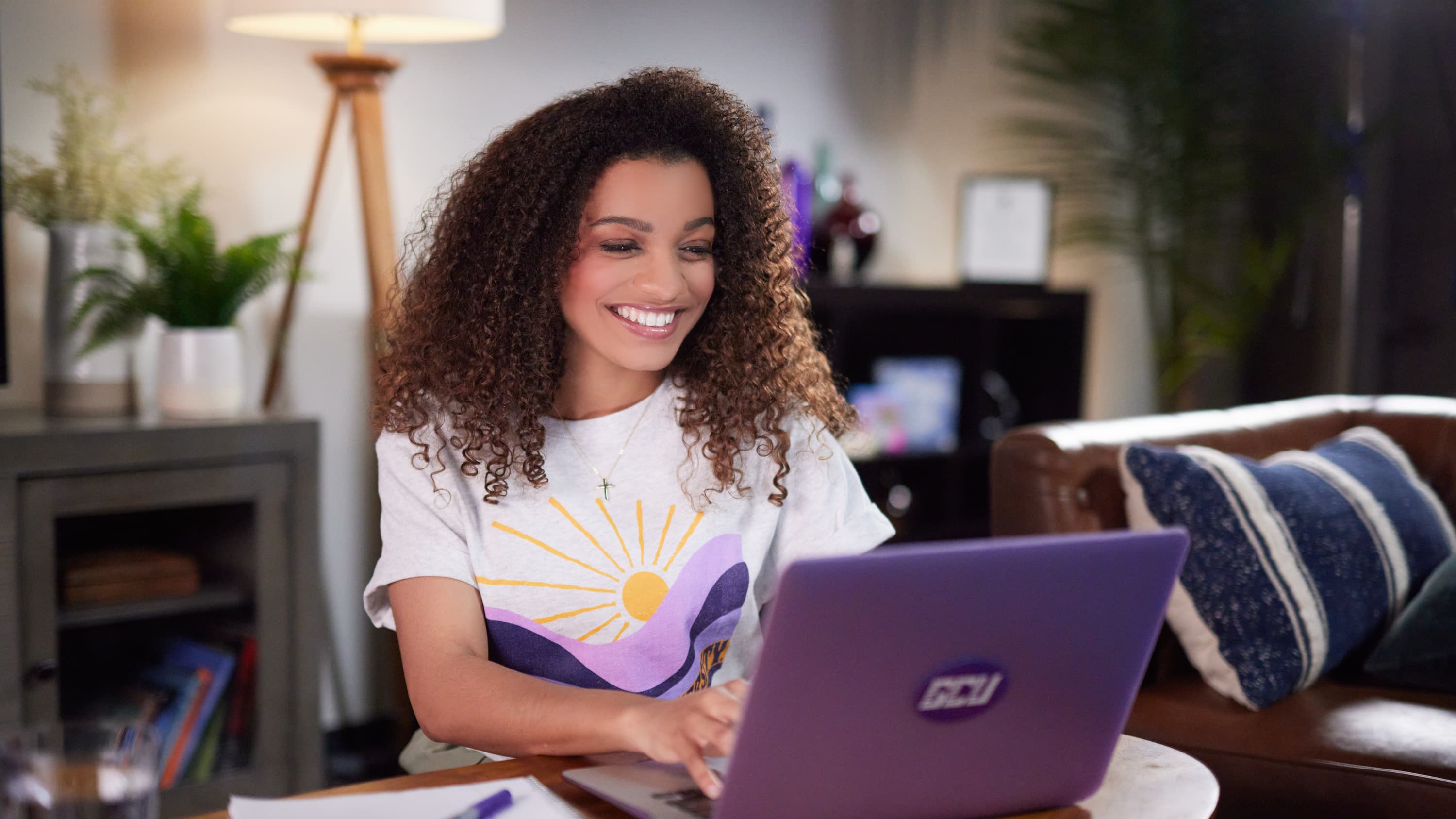 Student working on assignment on laptop