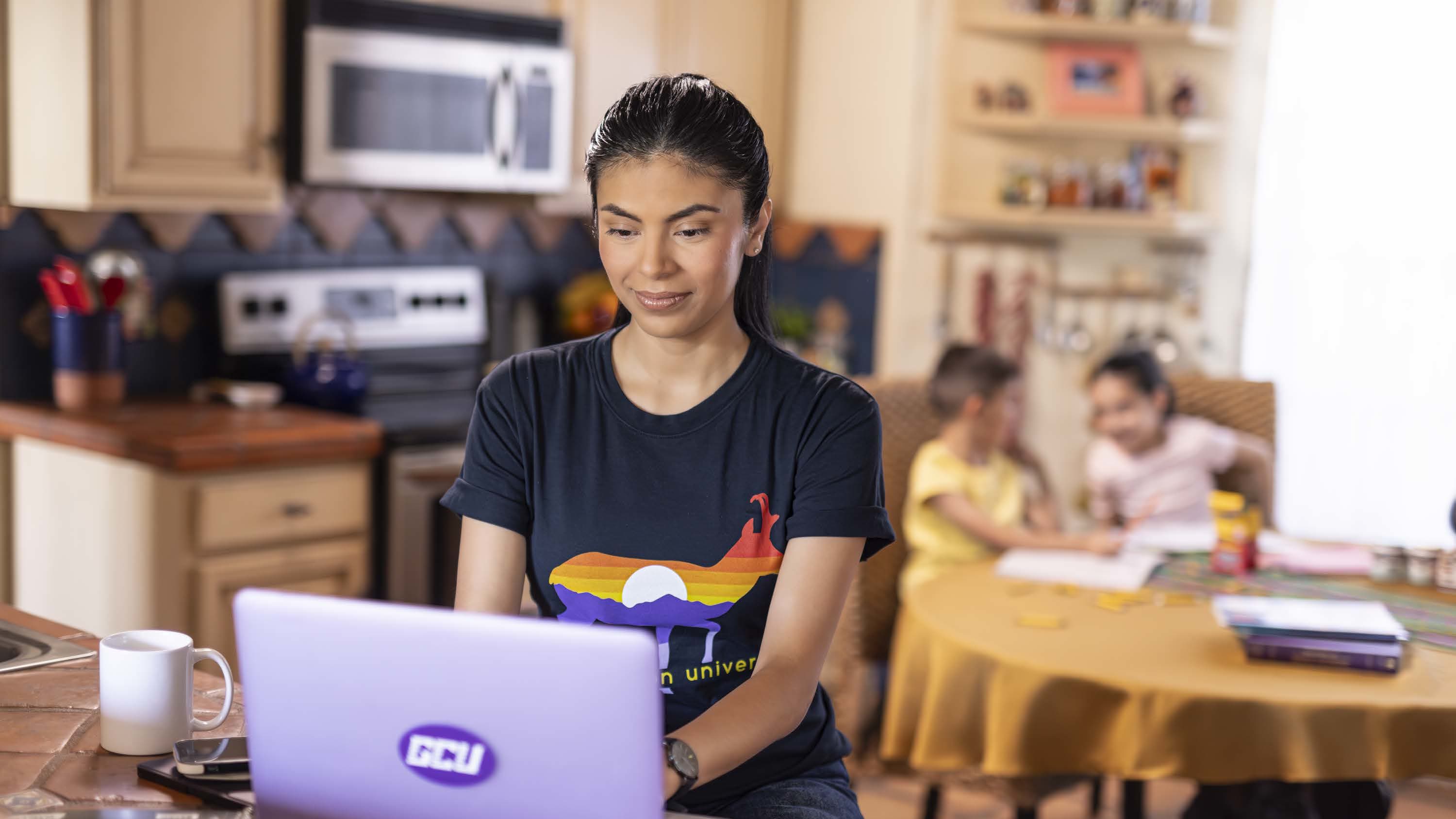 Graduate student working on her certificate at home