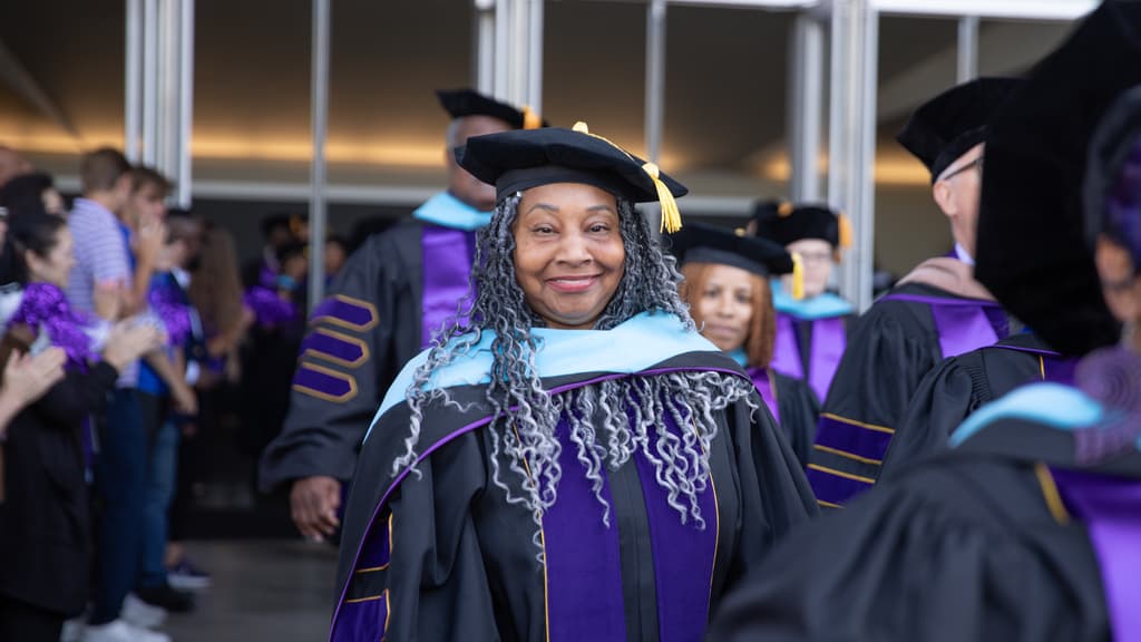 Doctoral Graduate After Graduation in Robes