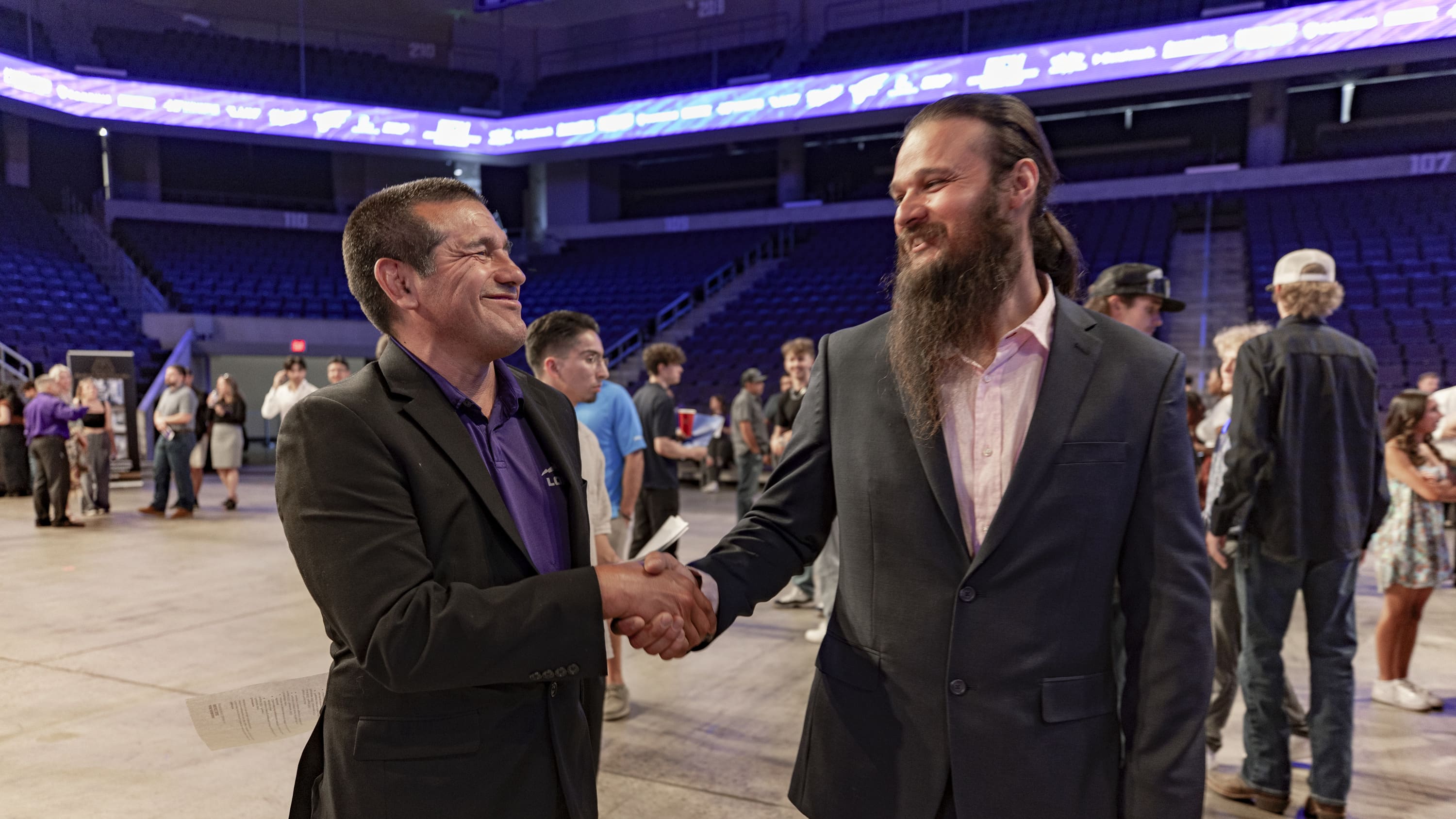 2 guys shaking hands making business deal