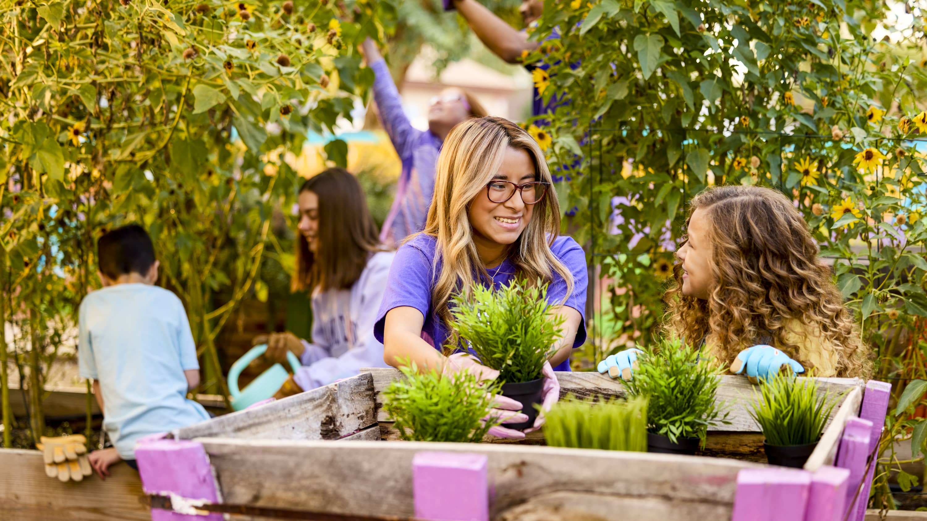 Woman and little girl gardening