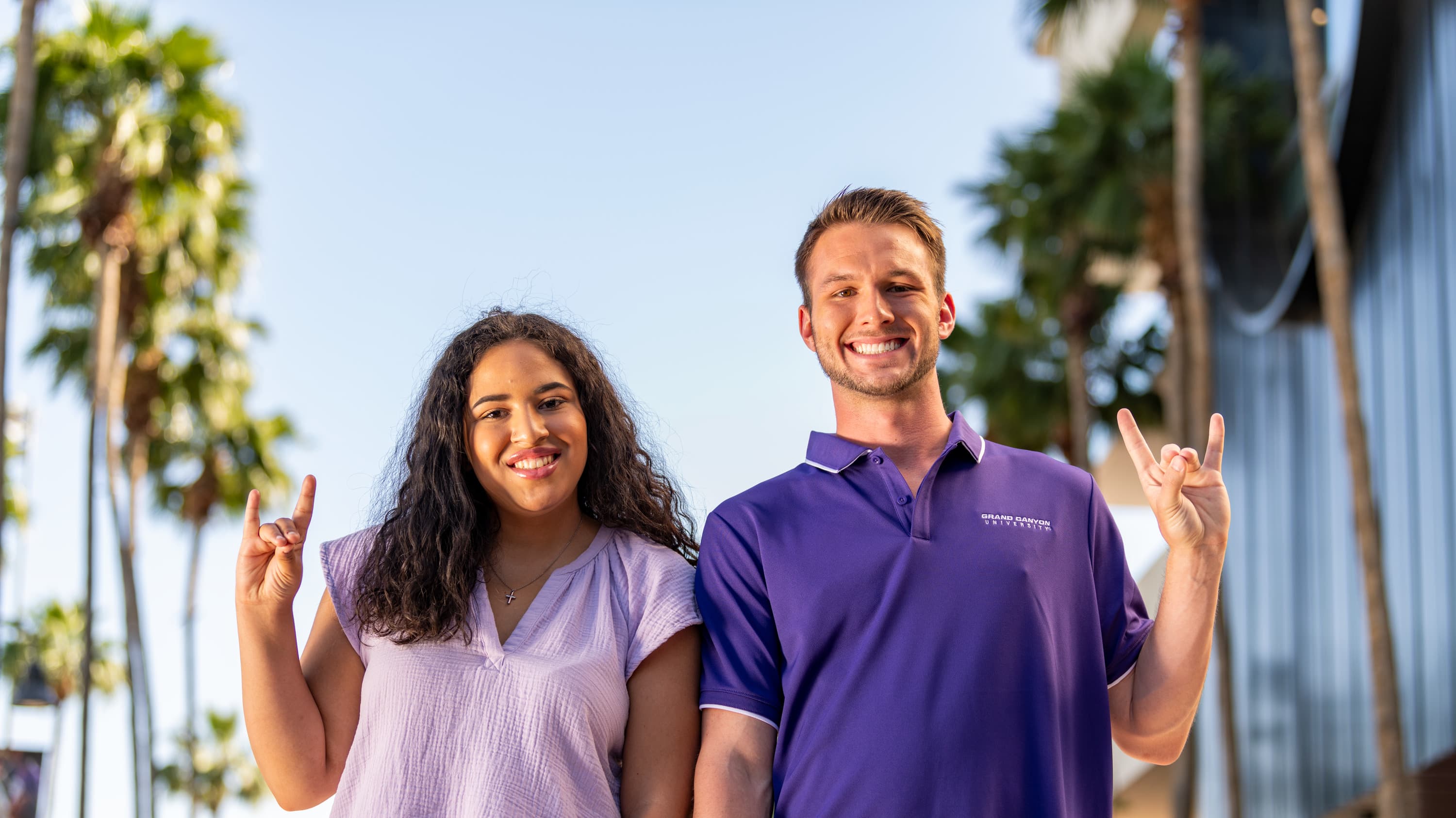 Female and male bachelor's counseling program students smiling on GCU's campus