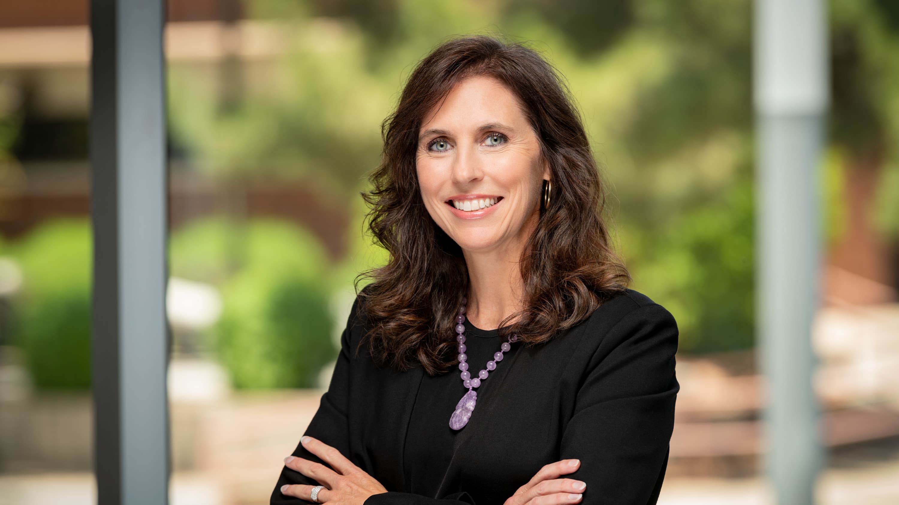 Female government degree graduate smiling for headshot