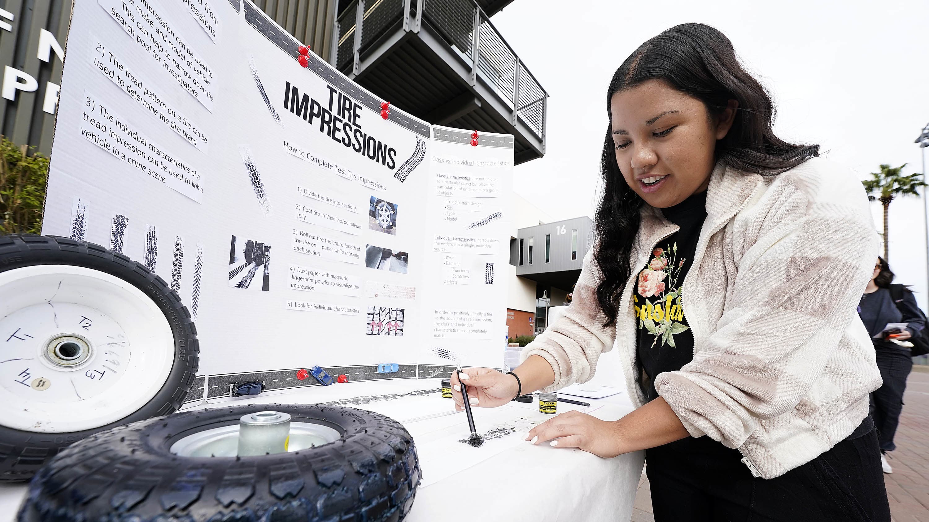 Female forensic science degree student presenting senior capstone at GCU