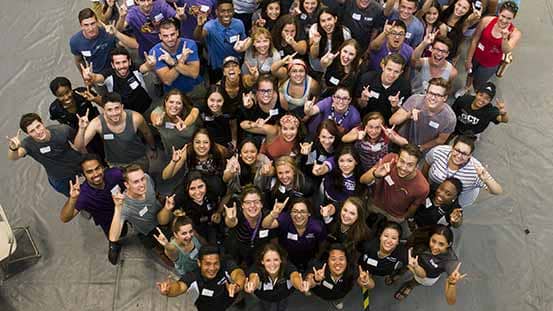 GCU students smiling in group photo on campus in spiritwear