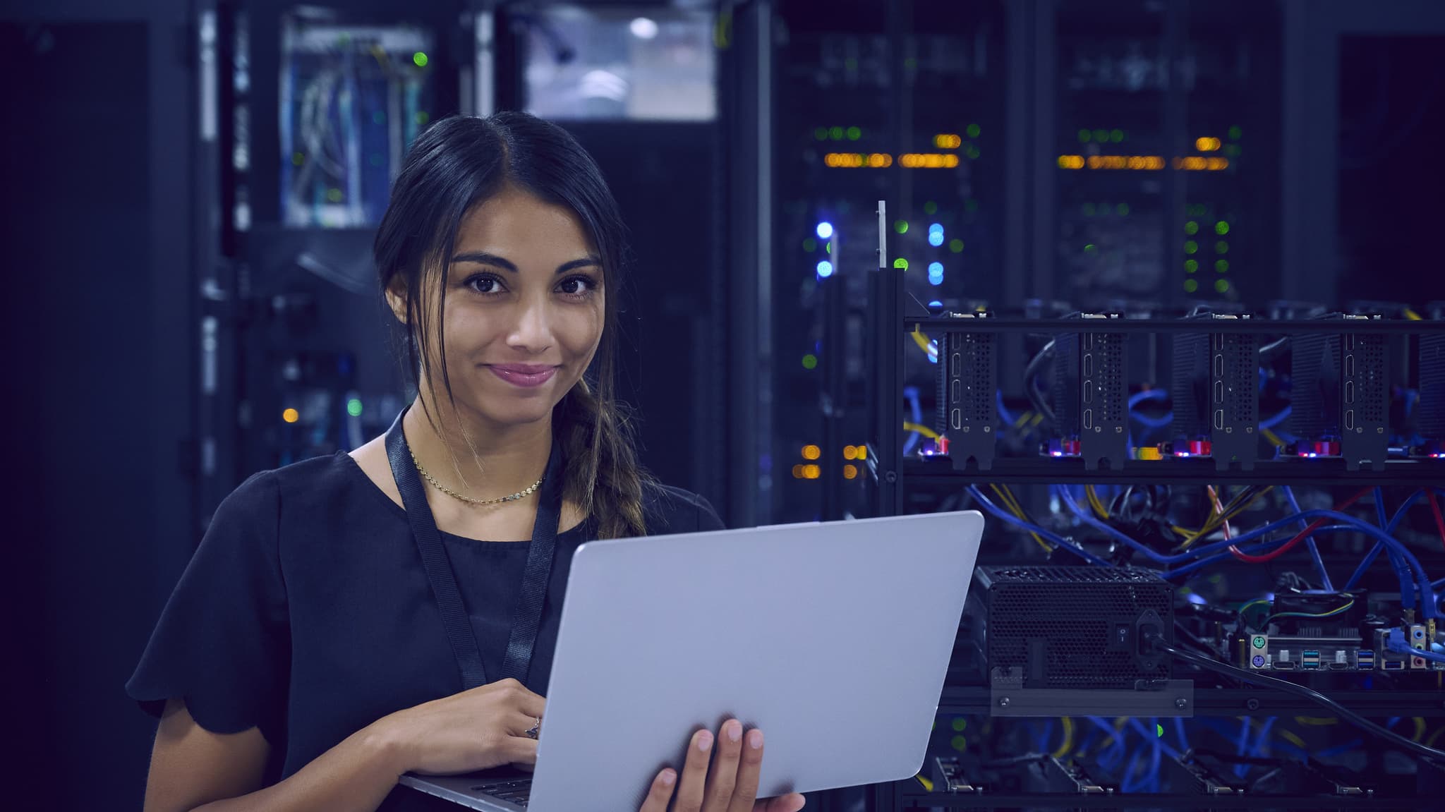 Cybersecurity Student Holding Laptop