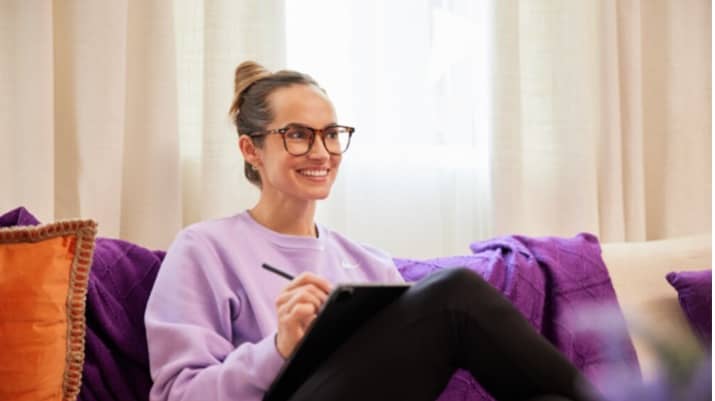 Girl in her room sitting on the couch