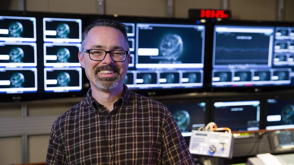 Developer smiling in the server room