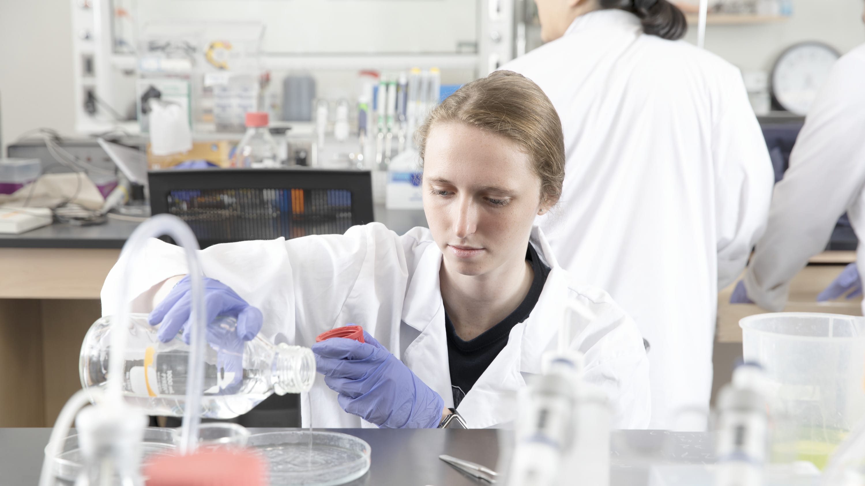Woman pathologist working on an experiment in a lab