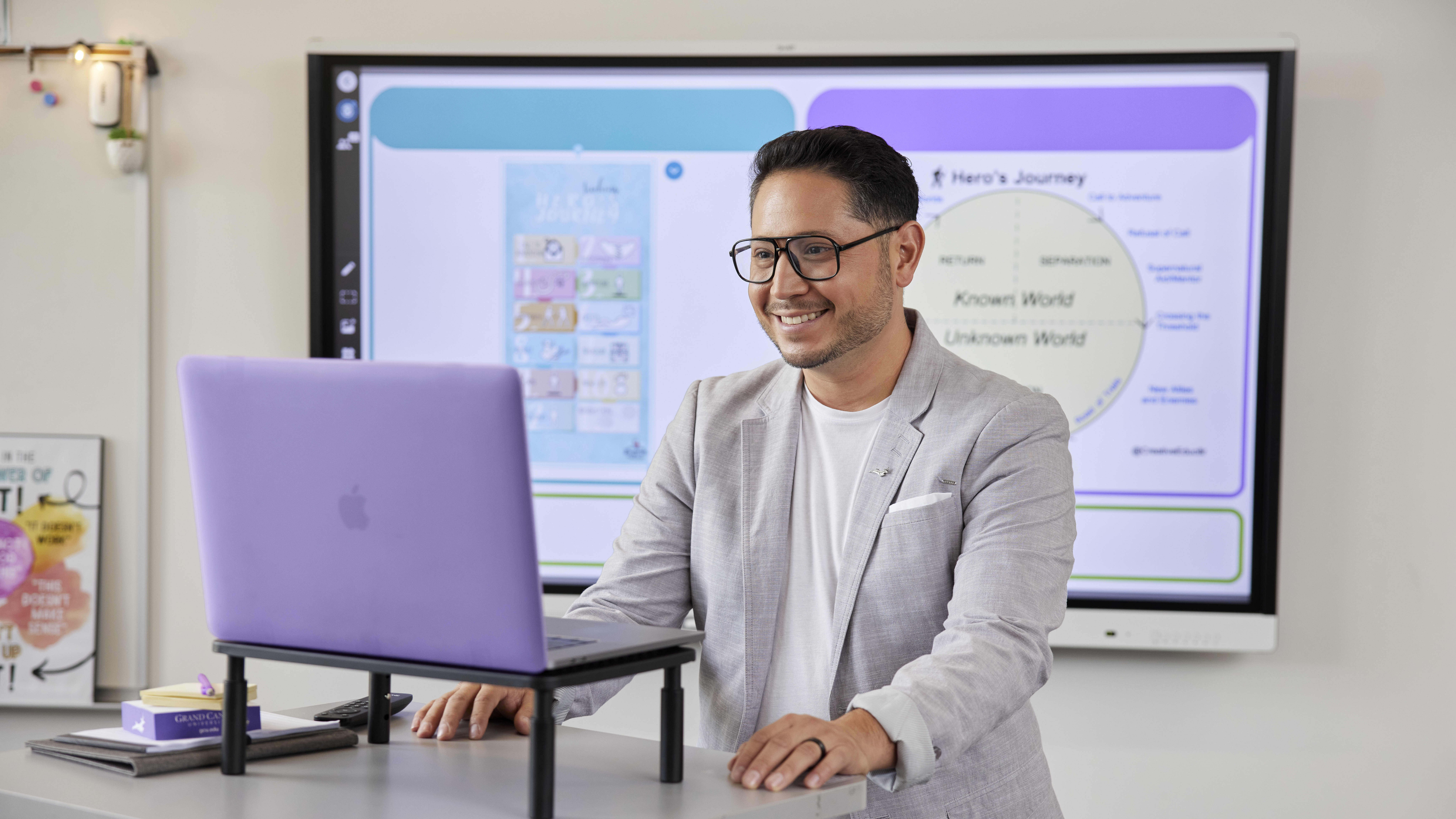 Teacher standing at a computer
