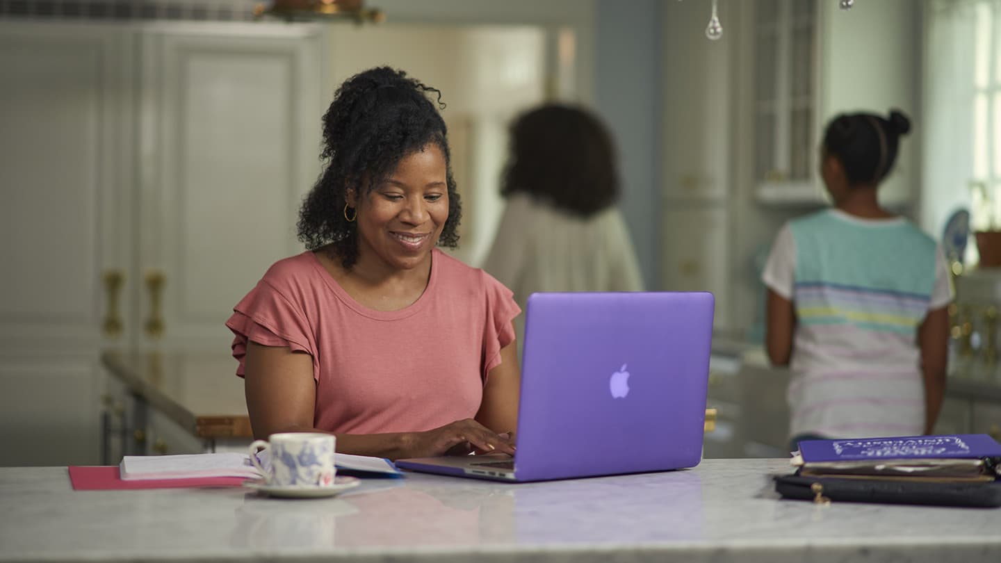 Female student researching tuition and financial aid options at GCU from home