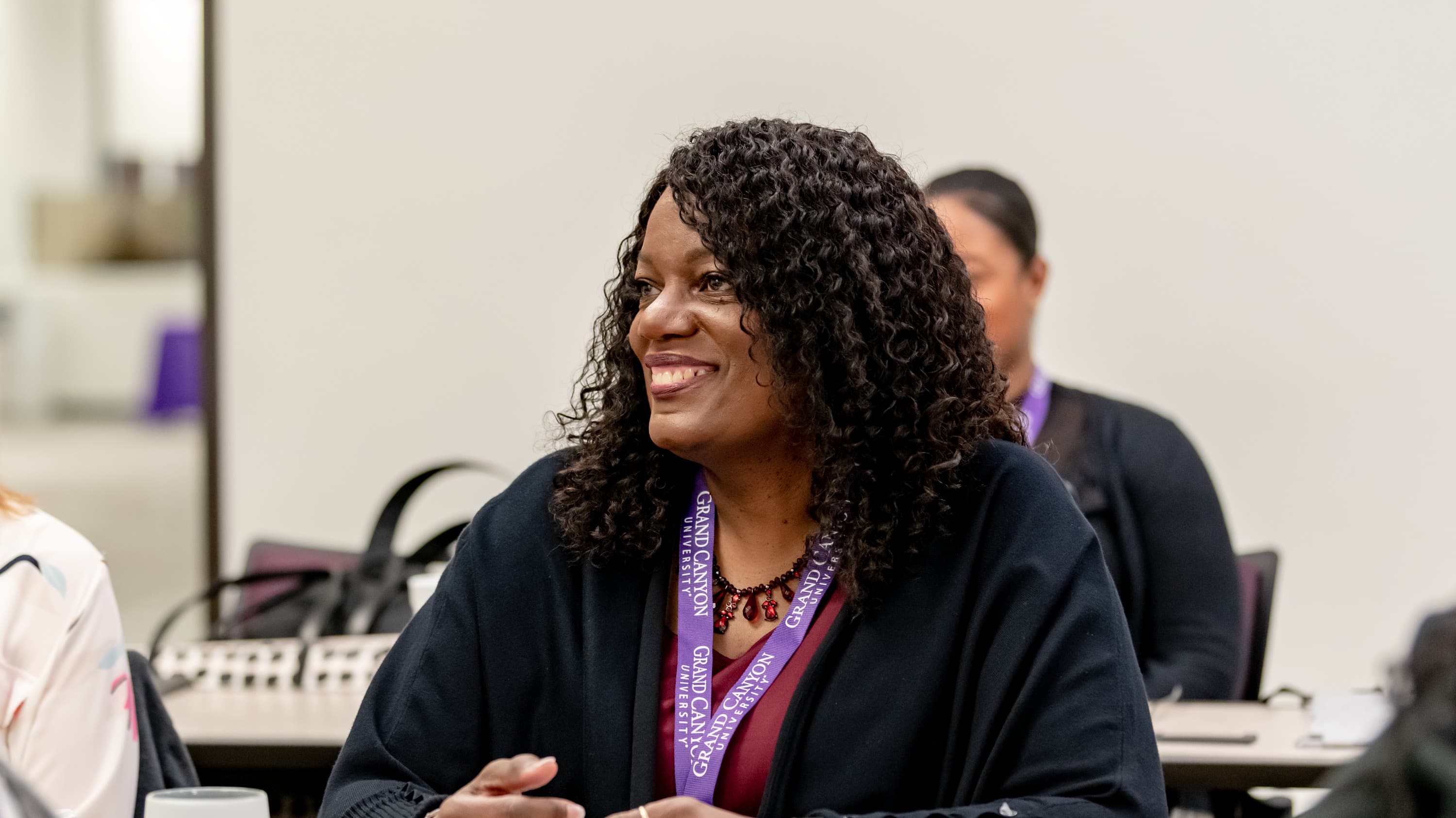 Female doctoral counseling program student smiling in classroom