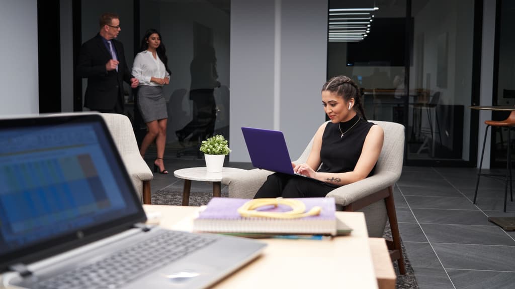 Developer Words on Laptop in Office Setting