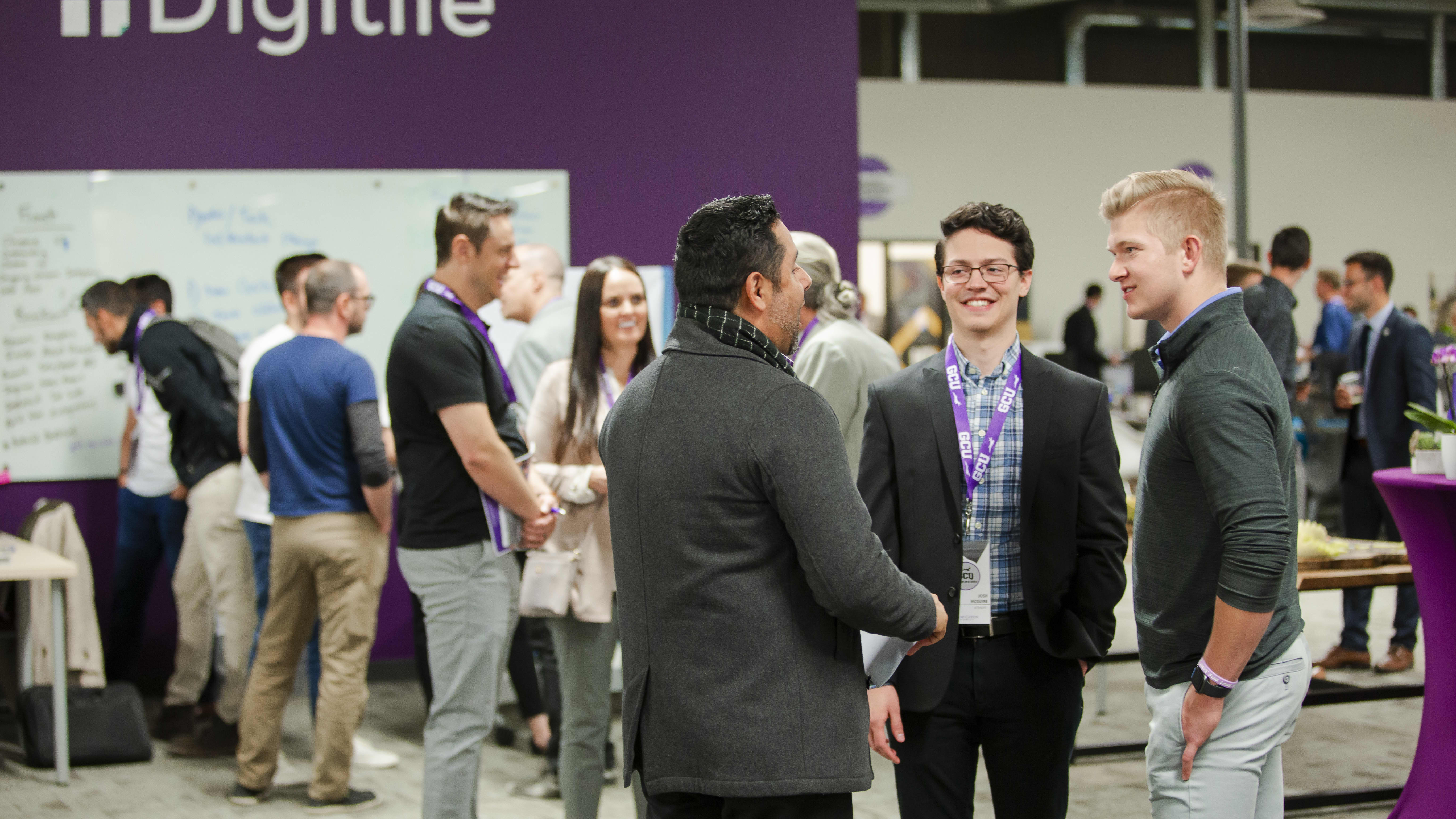 students talking to a professor at a canyon ventures event