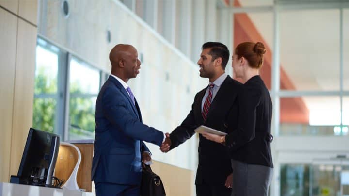 Business leaders shake hands