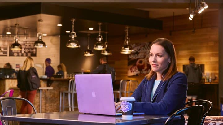 Online master's counseling degree student working online from remote location