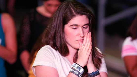 GCU student praying at Chapel service