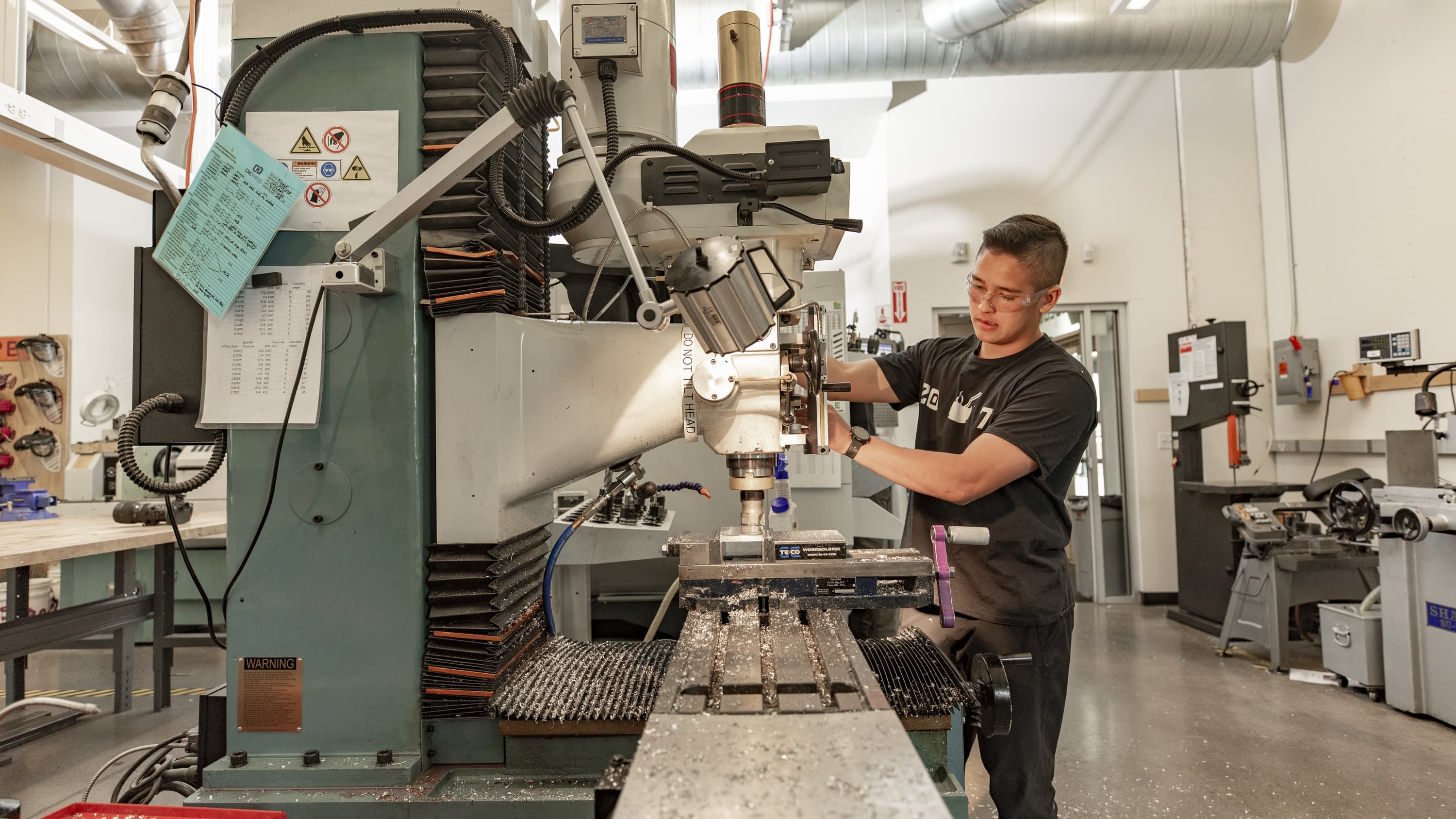 Student working with machines