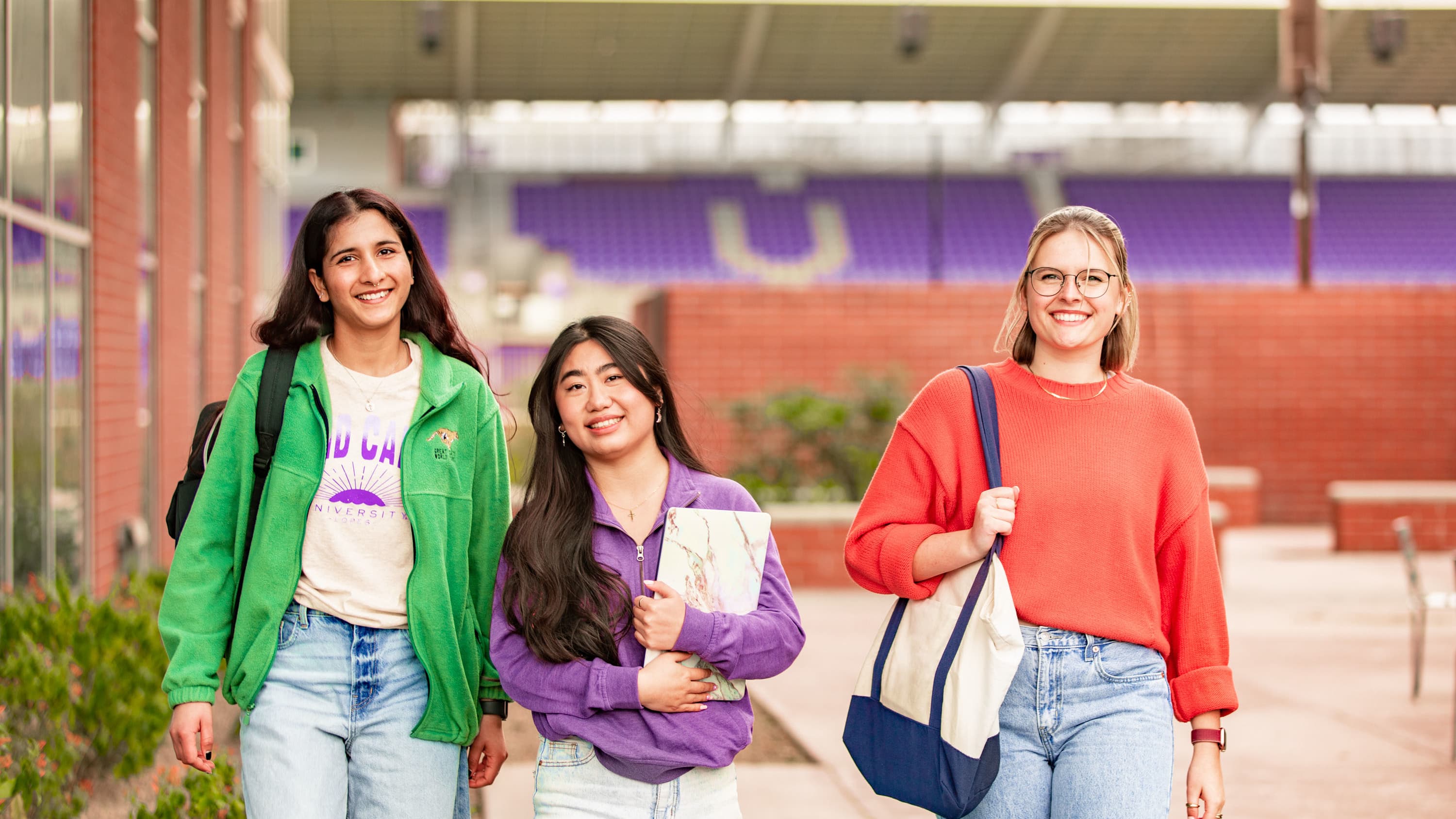 Female students walking around campus 