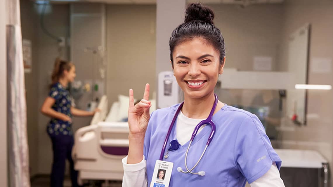 nursing student giving lopes in a lab. 