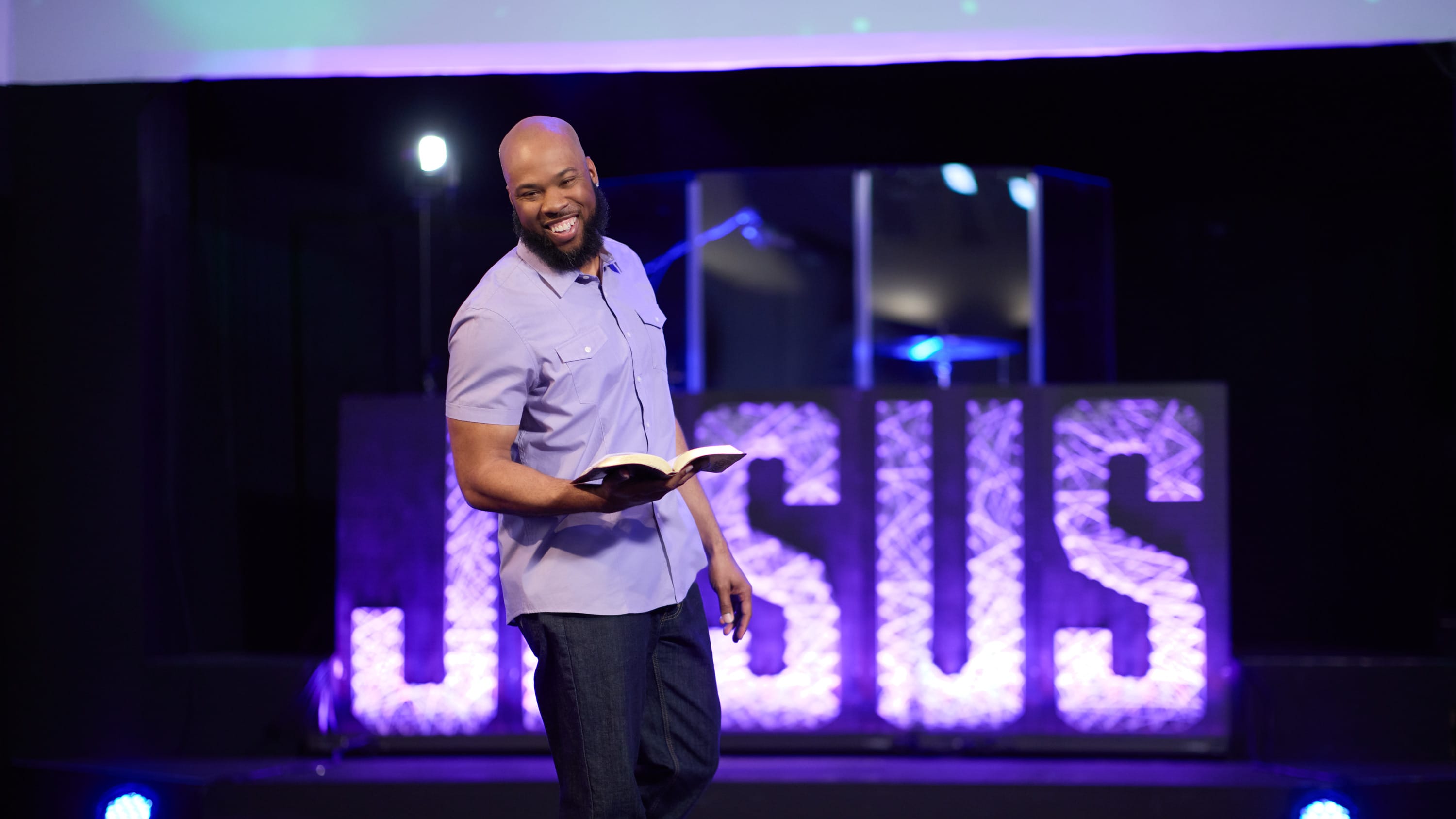 Male theology minor speaking at GCU chapel with Bible