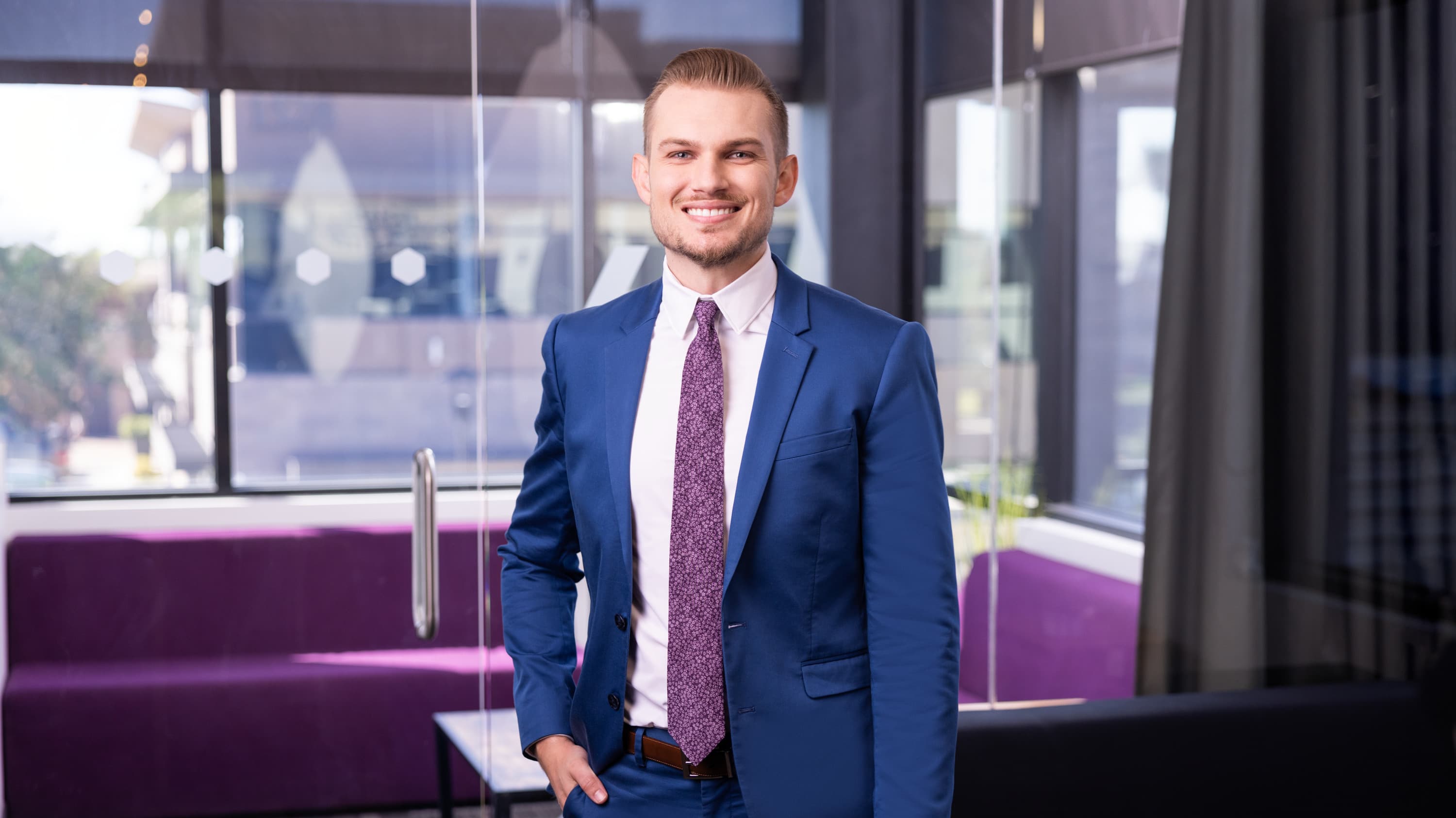 Male BS in Business Administration degree student smiling for headshot