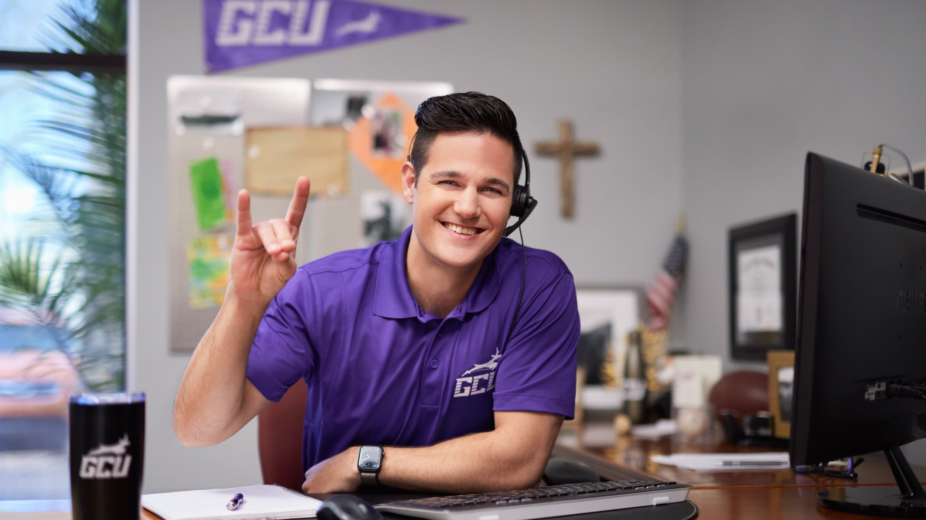 GCU Student helping at a service center