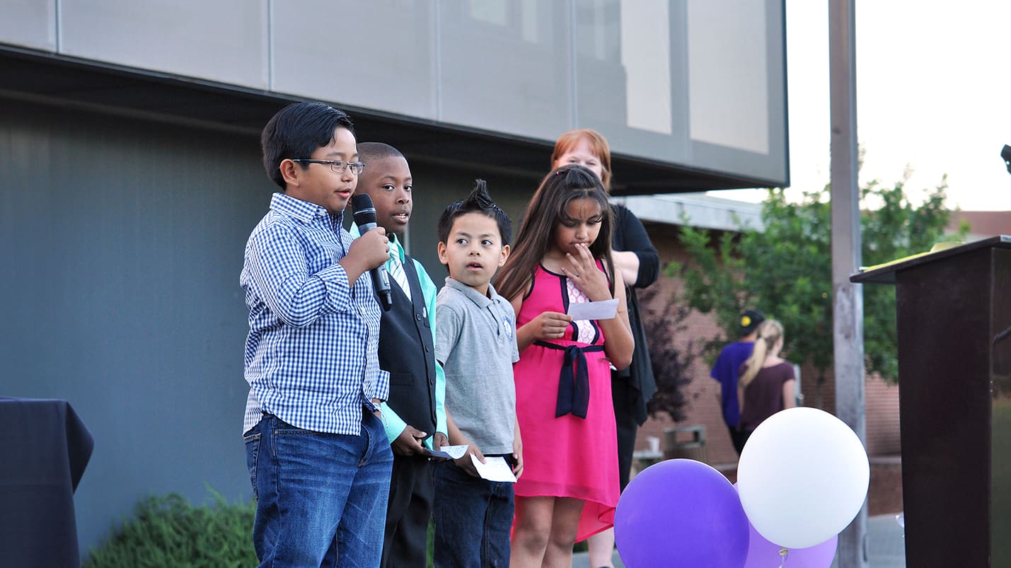 A child holding a microphone