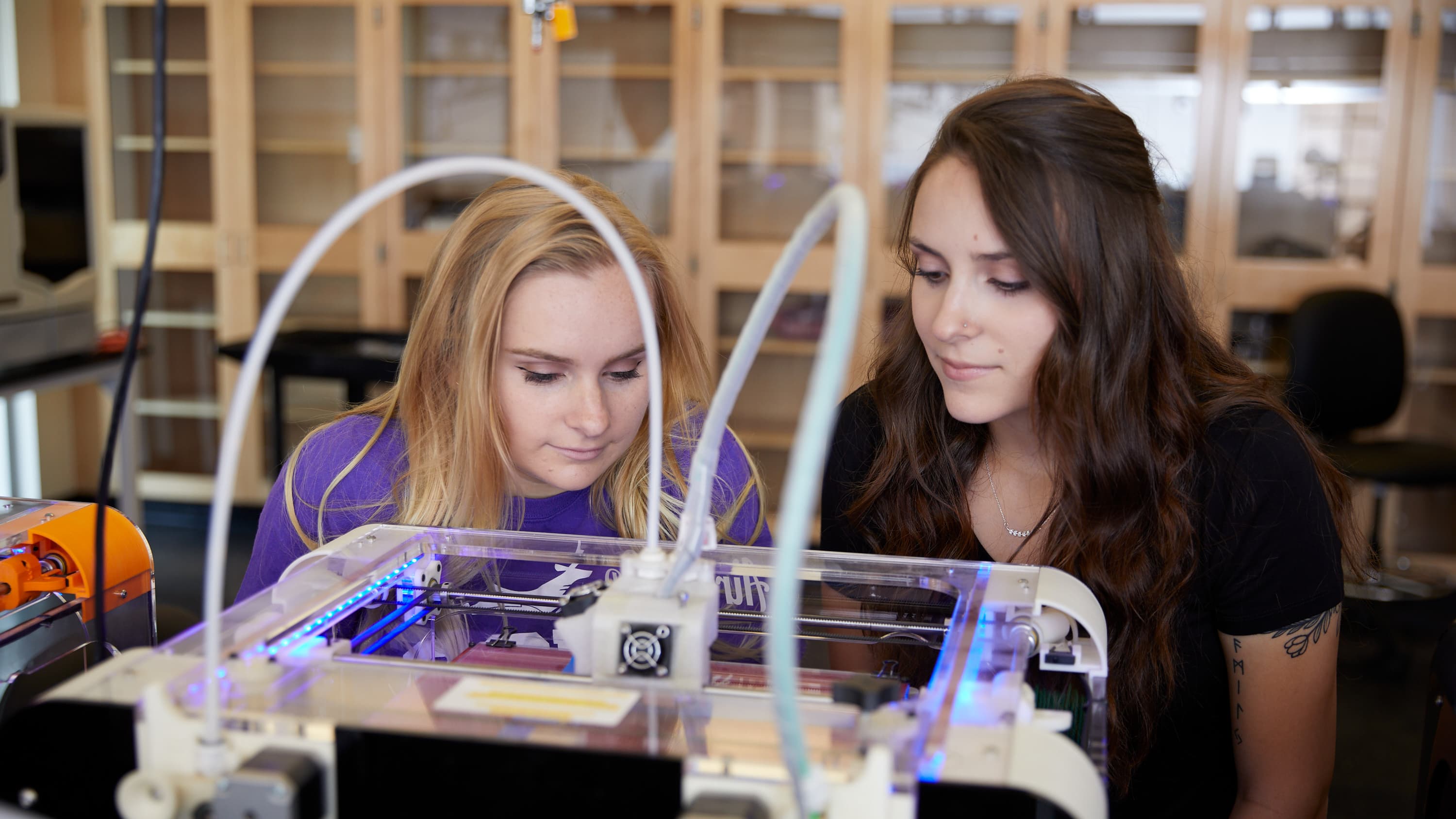 Female computer engineering degree emphasis students working in GCU lab