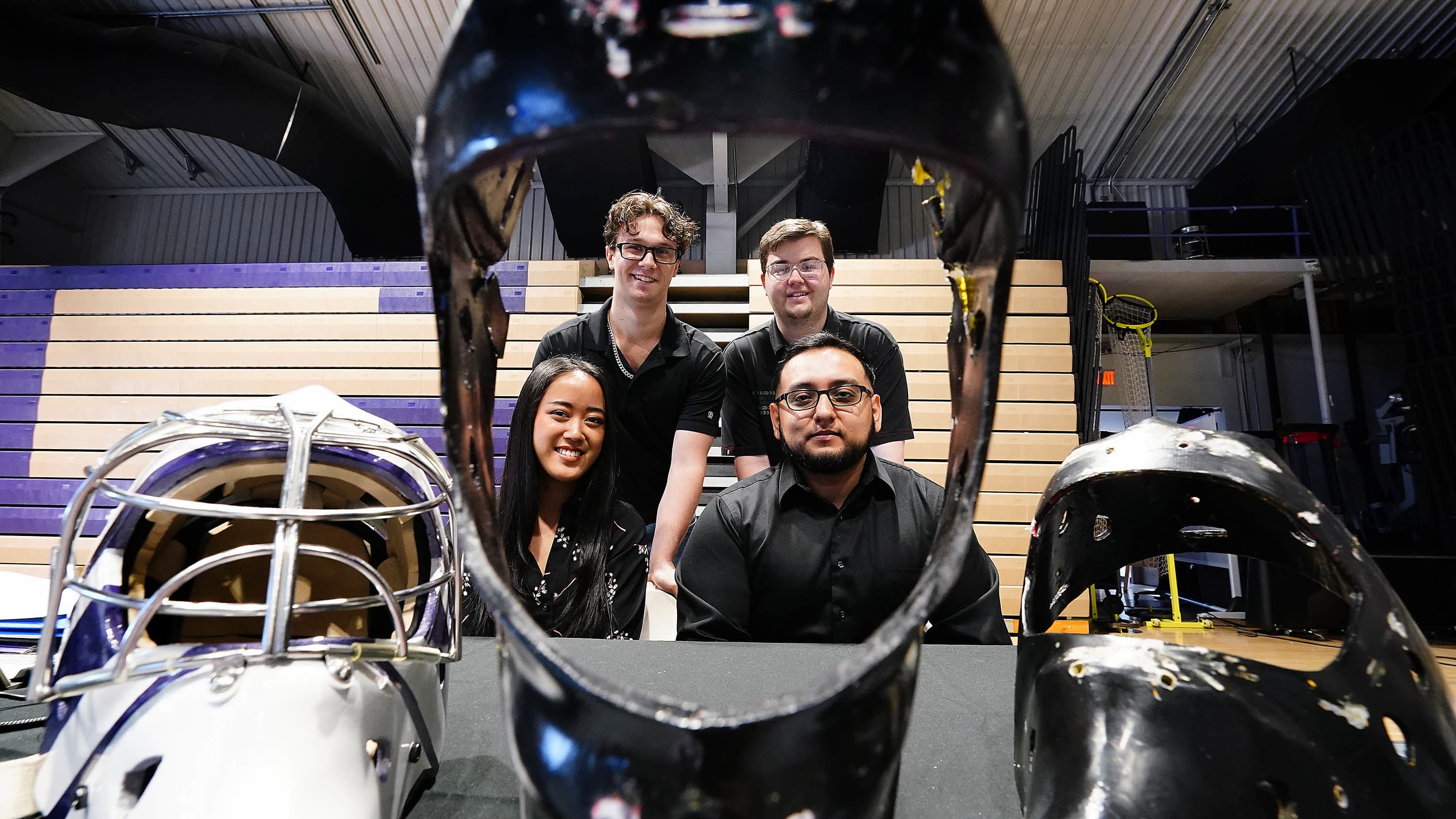 Female and male STEM minors smiling with engineering capstone assignment