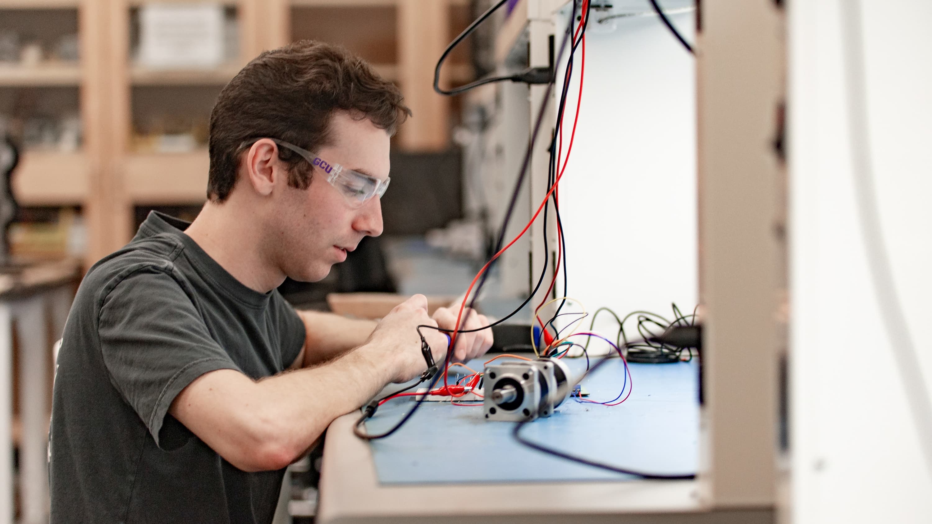 Male engineering student working on capstone project in the lab