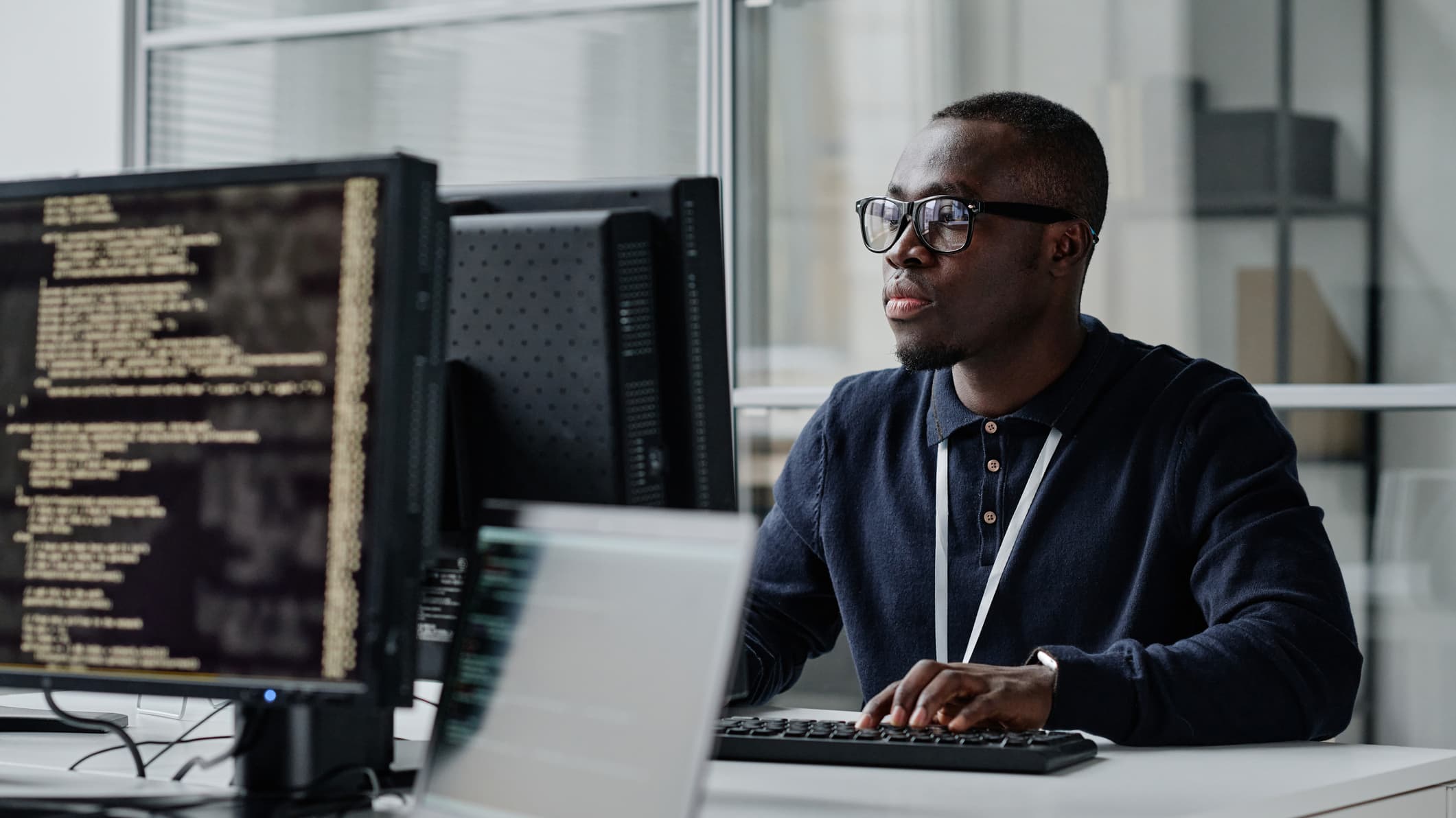 Cybersecurity Employee Working at Office Desk