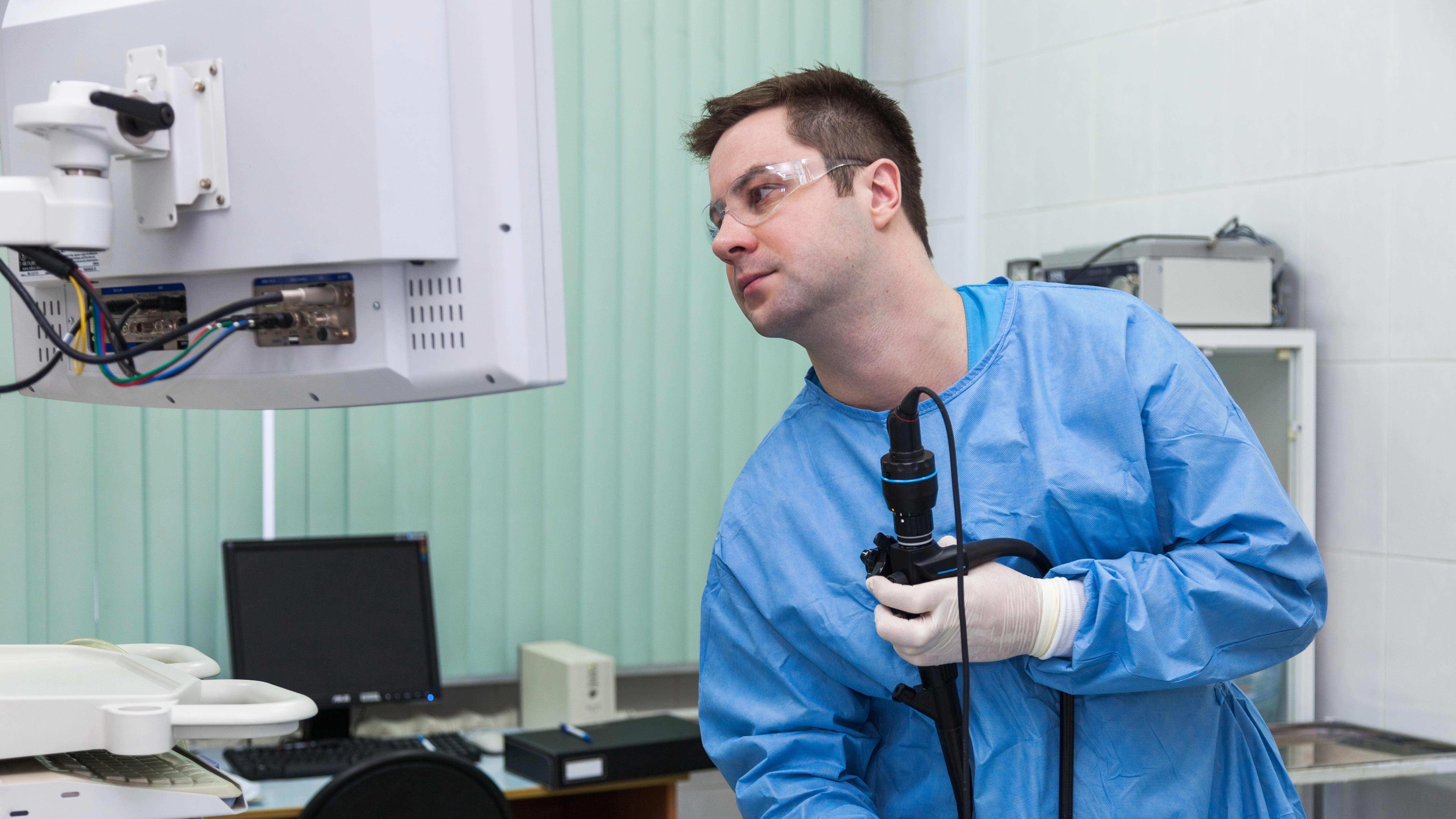 Autopsy Technician Working on Lab Equipement