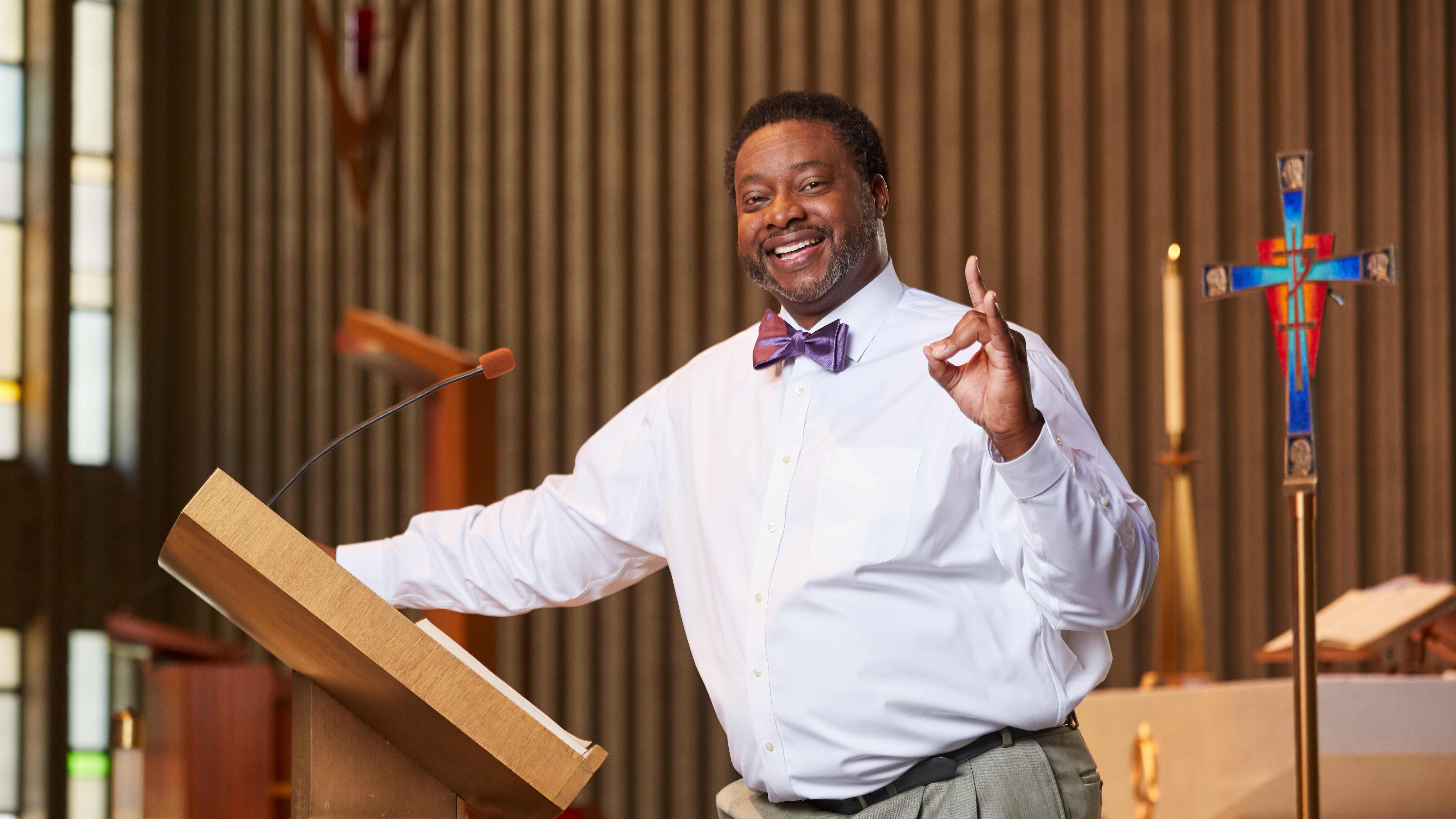 Male doctoral ministry program student smiling in church