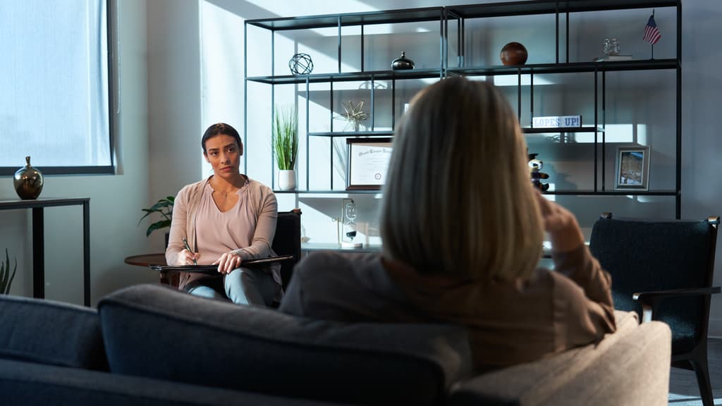 Psychologist Sits With Patient in Office