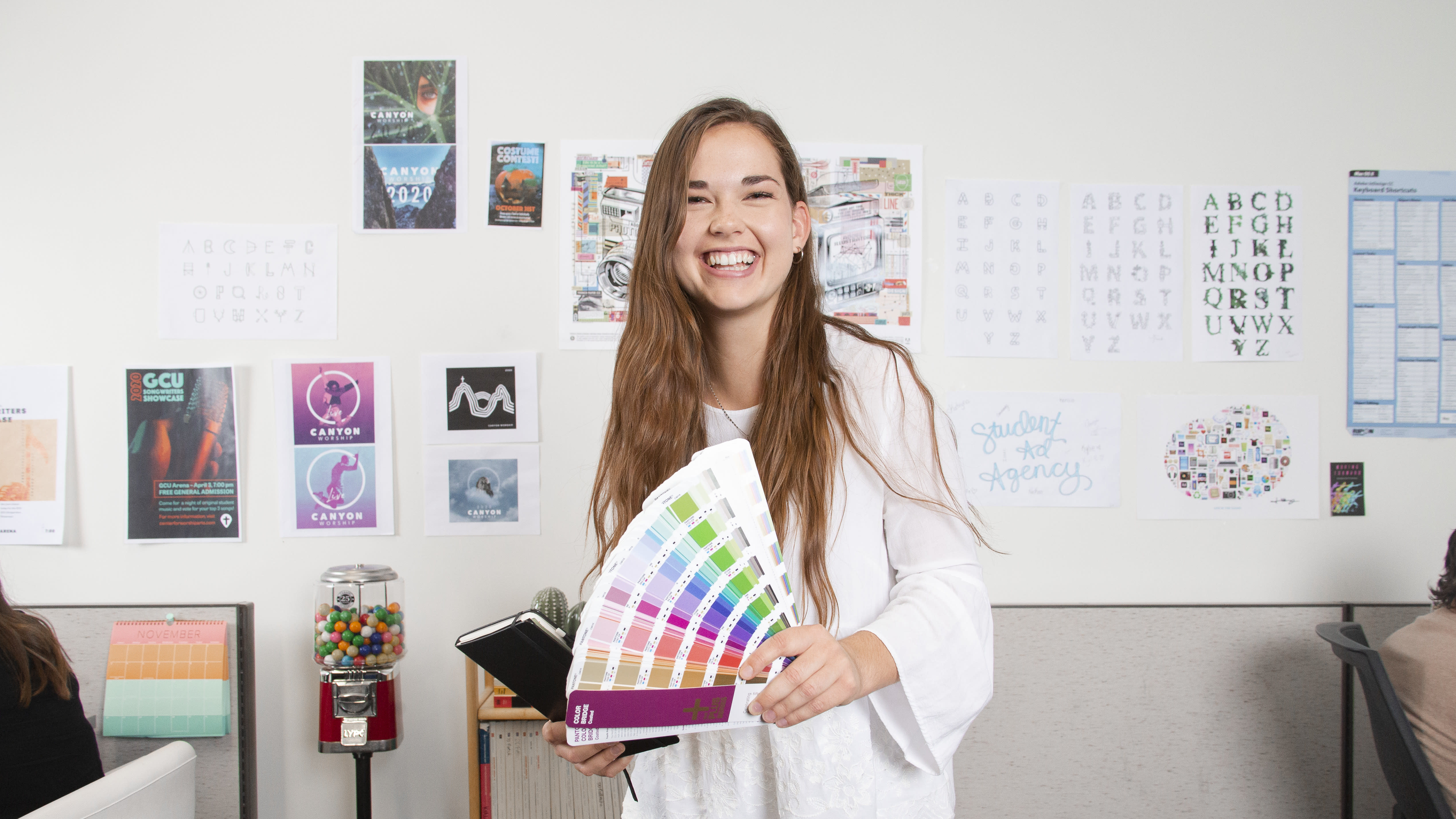 Student holding color swatches