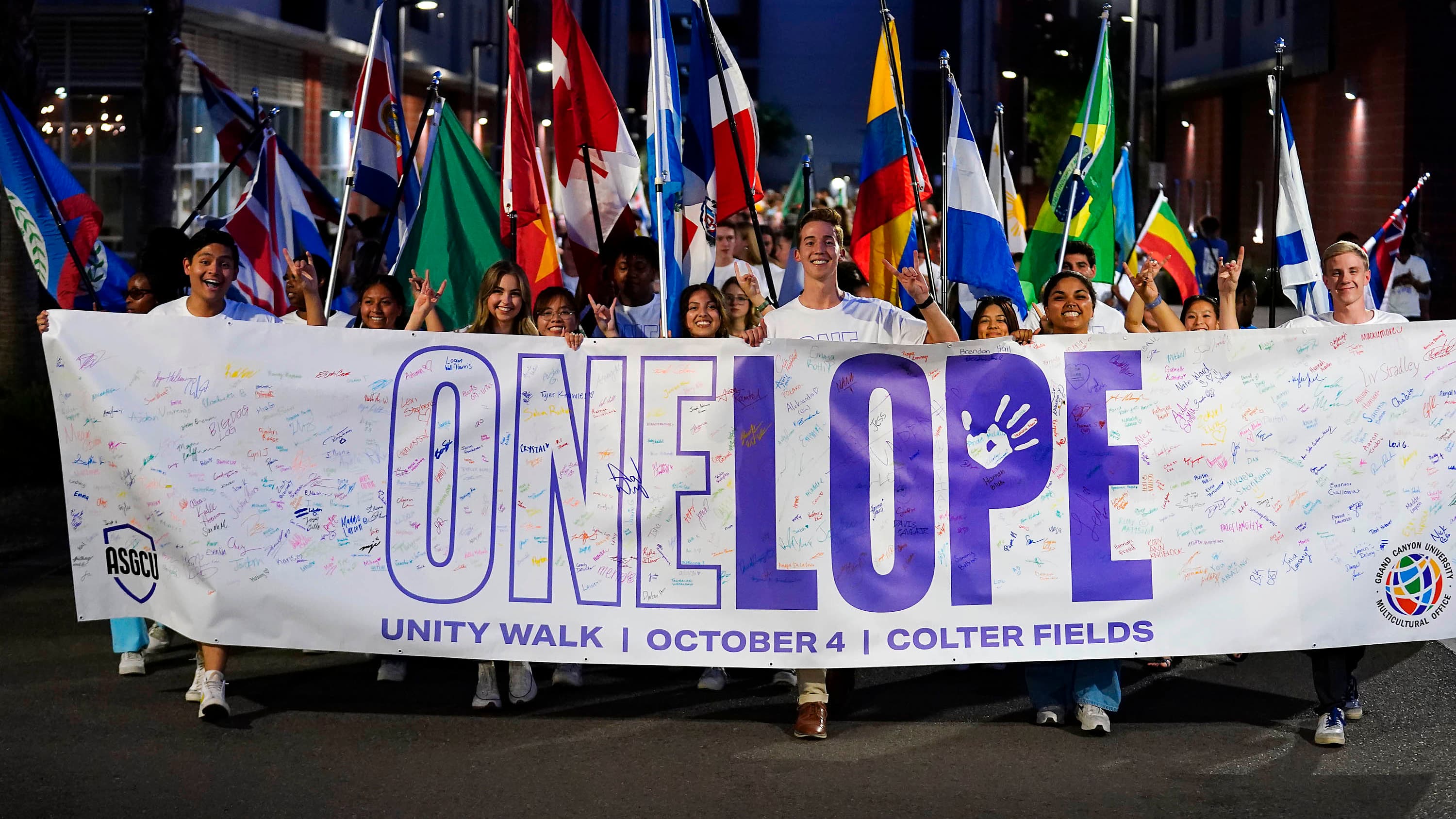 GCU Students at GCU Unity Walk with One Lope Sign