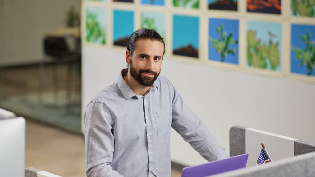 Doctoral student at GCU studies in front of a computer