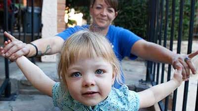 Mother and daughter sitting on some stairs