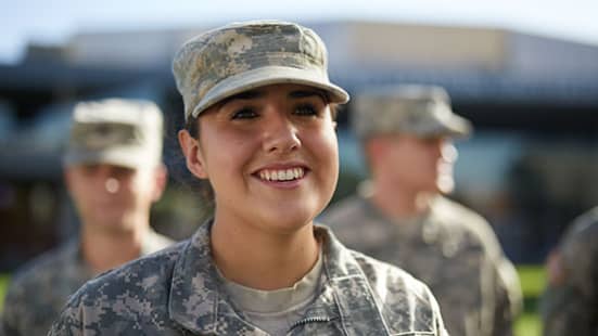 GCU Military Student Smiles in Line with Other Military Members