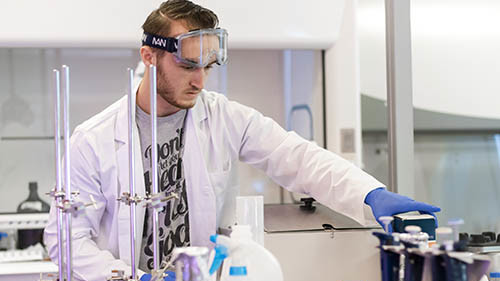 Science Student working in a laboratory setting