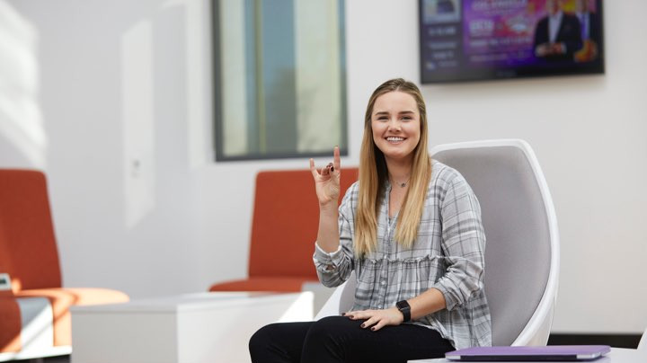 a business student throwing up the Lopes