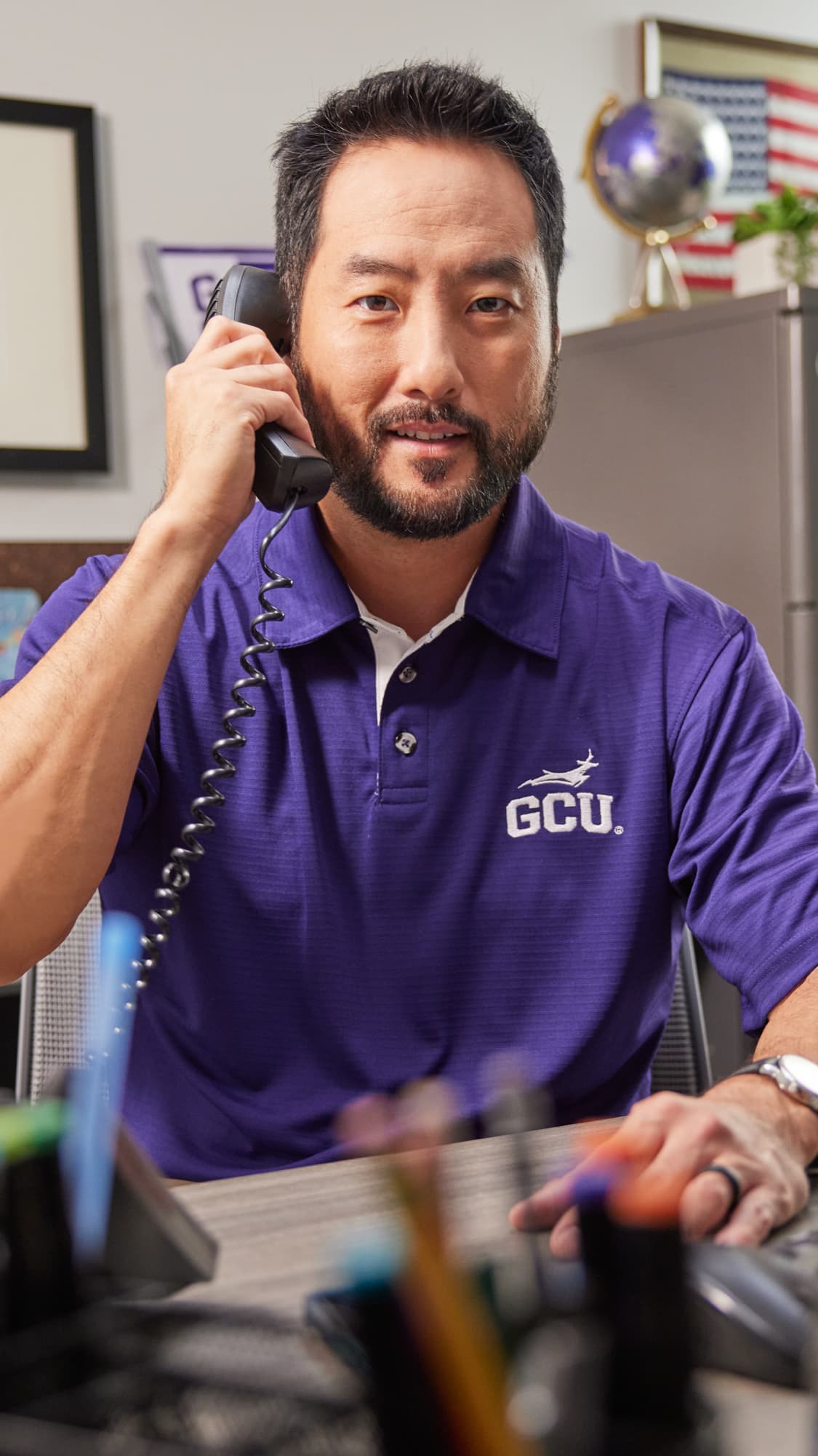 Male counselor enrolling student by phone for continuing education courses
